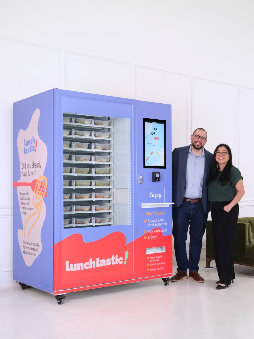 The Lunchtastic founders beside a kiosk
